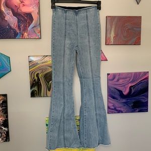 Flare bottom jeans with an elastic waistband.
